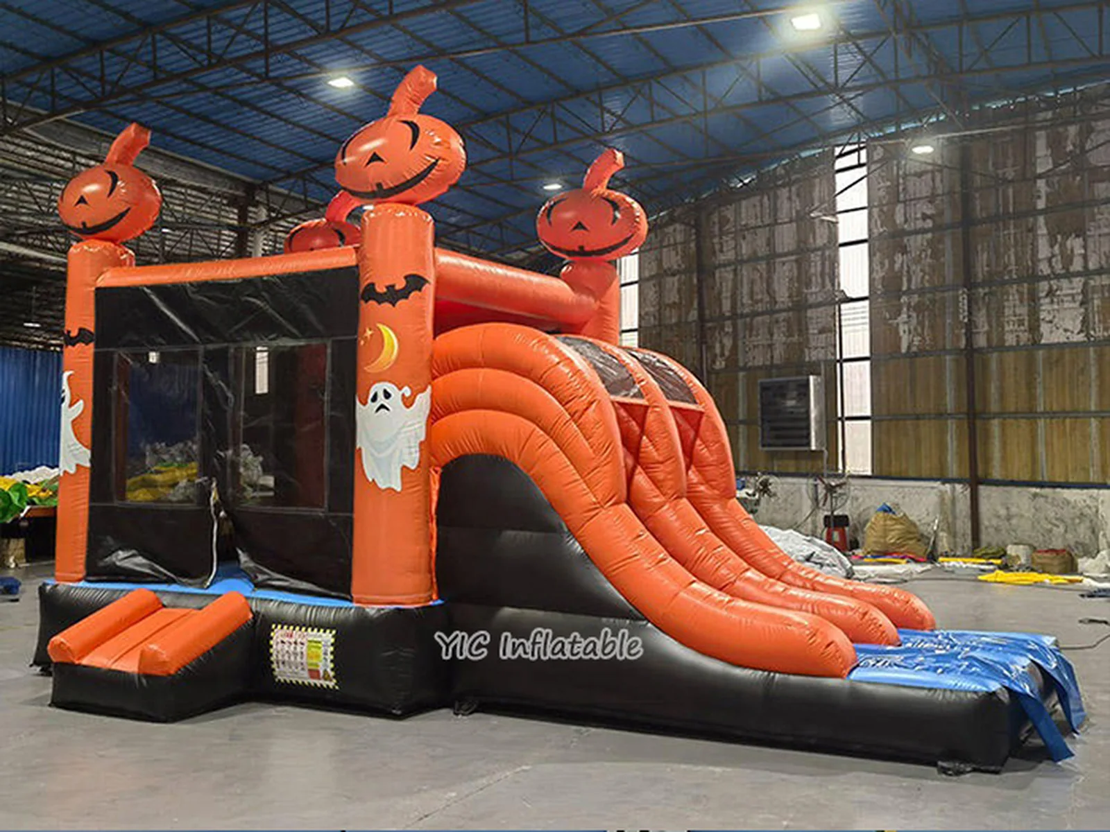 halloween themed inflatable bounce-and-slide attraction front view