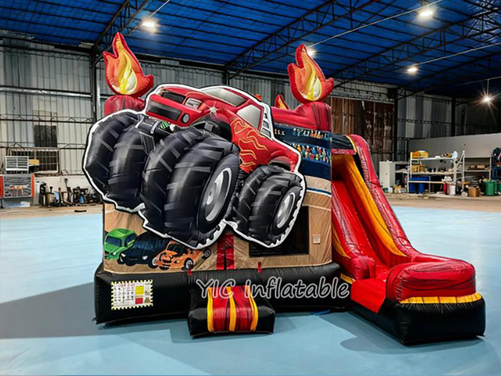 monster truck themed inflatable bounce-and-slide attraction front view