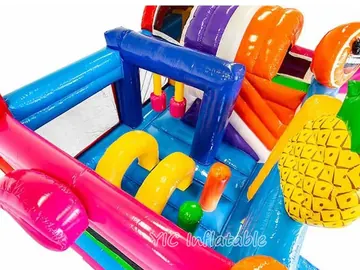 tropical themed inflatable bounce-and-slide attraction detail view