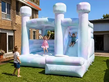 rainbow themed inflatable bounce-and-slide attraction rear view