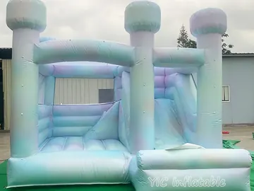 rainbow themed inflatable bounce-and-slide attraction detail view